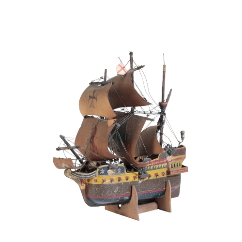 234 - A 1930'S WOODEN MODEL OF AN EXPLORATION ERA SHIP the hull of the caravel painted yellow, on a wooden... 