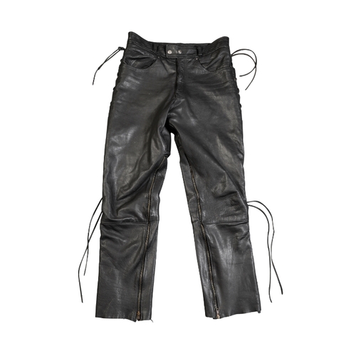 33 - A PAIR OF BIKER'S GEARBOX LEATHER LACED JEANS with a Harley Davidson buckle, 32