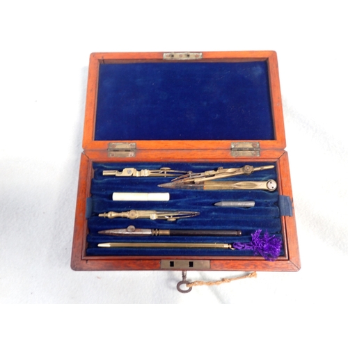 19 - A MAHOGANY BOXED DRAWING INSTRUMENTS with key