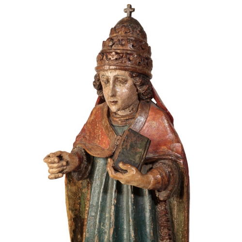 104 - A POLYCHROME-DECORATED CARVED LIMEWOOD FIGURE OF A POPE Probably late 16th century, With crimson cop... 