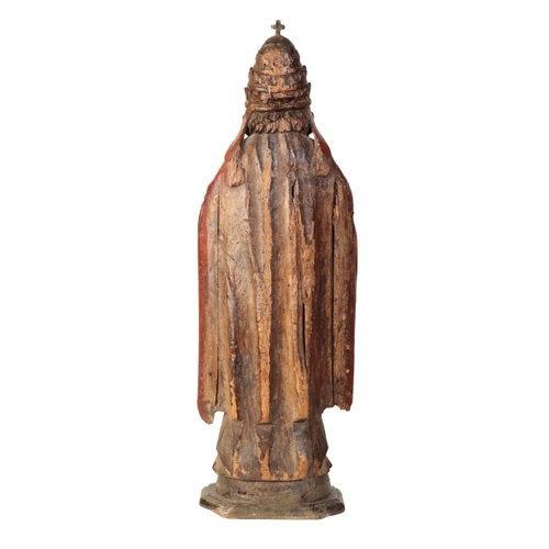 104 - A POLYCHROME-DECORATED CARVED LIMEWOOD FIGURE OF A POPE Probably late 16th century, With crimson cop... 