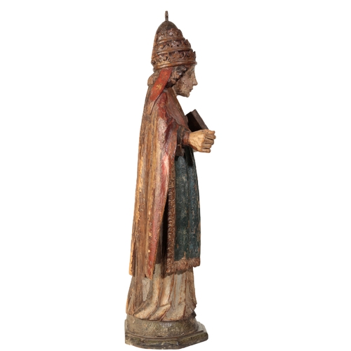 104 - A POLYCHROME-DECORATED CARVED LIMEWOOD FIGURE OF A POPE Probably late 16th century, With crimson cop... 