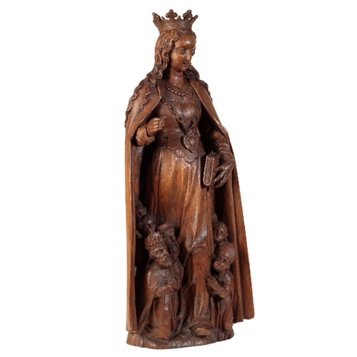 105 - A FLEMISH CARVED OAK FIGURE OF A SAINT, POSSIBLY ST URSULA 16th century, Depicted standing, wearing ... 