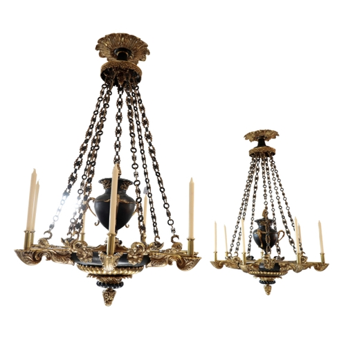 116 - A PAIR OF GILDED AND PATINATED BRONZE SEVEN-LIGHT COLZA OIL HANGING LIGHTS of Regency style, 20th ce... 