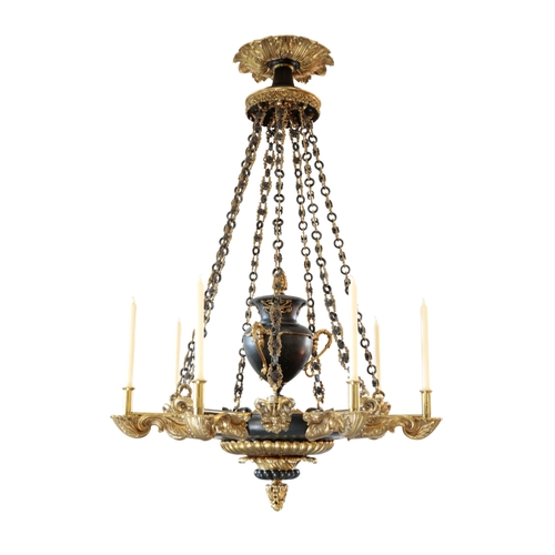 116 - A PAIR OF GILDED AND PATINATED BRONZE SEVEN-LIGHT COLZA OIL HANGING LIGHTS of Regency style, 20th ce... 