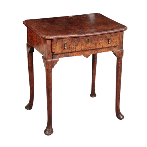 130 - A GEORGE II SOLID BURR-ELM SIDE TABLE second quarter of the 18th century, the rectangular top with r... 