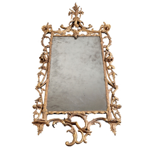 157 - AN EARLY GEORGE III GILTWOOD MIRROR, the rectangular plate within a pierced scrolling foliate and fl... 