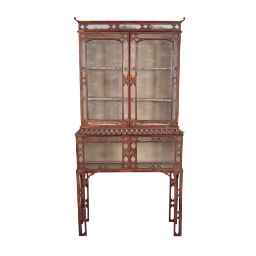 169 - A MID-VICTORIAN WALNUT DISPLAY CABINET-ON-STAND mid-19th century, of George II style, the rectangula... 