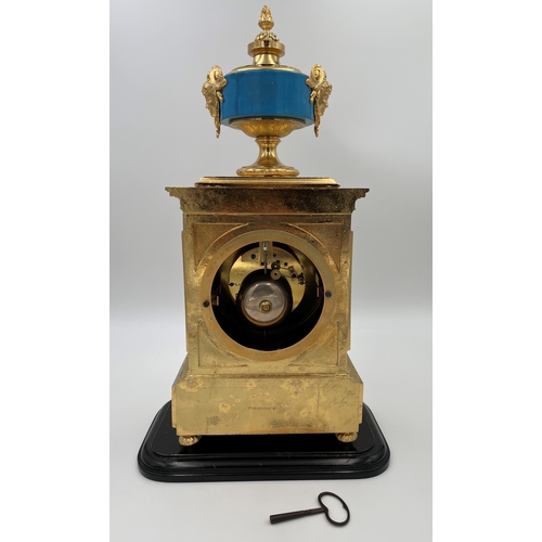 118 - A GILT METAL AND PORCELAIN MOUNTED MANTEL CLOCK Of LOUIS XVI STYLE the porcelain dial painted with c... 