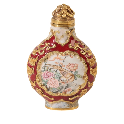 74 - A FINE CHINESE ENAMEL SNUFF BOTTLE decorated with panels of birds and flowers, the base with a four ... 