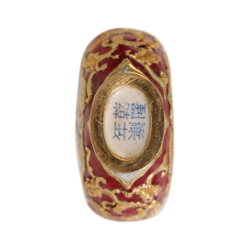 74 - A FINE CHINESE ENAMEL SNUFF BOTTLE decorated with panels of birds and flowers, the base with a four ... 