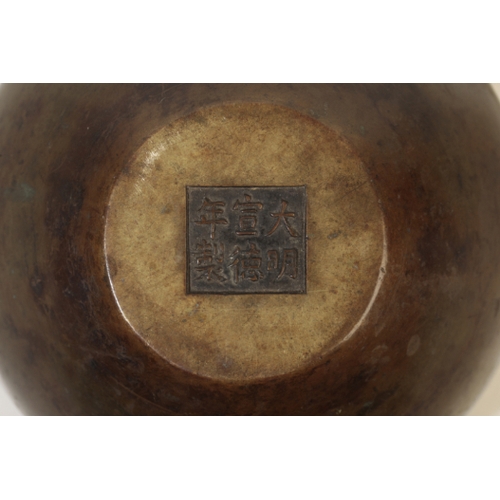 76 - A CHINESE BRONZE CENSER, of plain form with rounded shoulders, the base with a finely-cast six chara... 