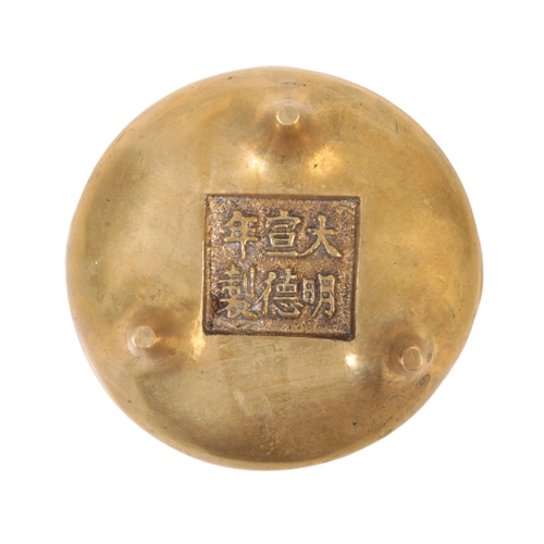 77 - A CHINESE GILT BRONZE MINIATURE TRIPOD  CENSER with simple loop handles, the interior cast with a co... 