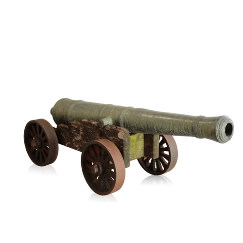 83 - A RARE CHINESE BRONZE CANNON, QIANLONG, DATED 1789 with a well patinated surface, the cannon bears i... 