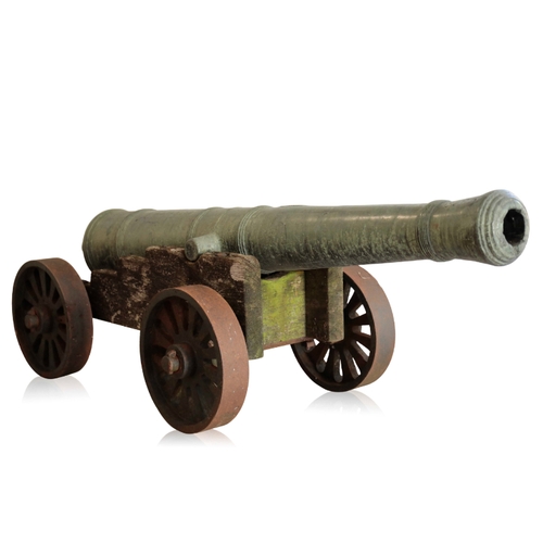 83 - A RARE CHINESE BRONZE CANNON, QIANLONG, DATED 1789 with a well patinated surface, the cannon bears i... 