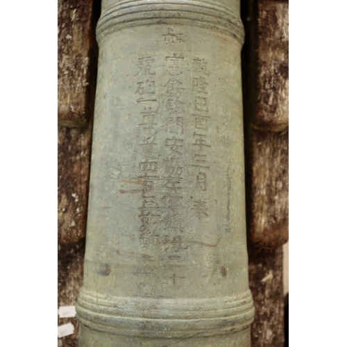 83 - A RARE CHINESE BRONZE CANNON, QIANLONG, DATED 1789 with a well patinated surface, the cannon bears i... 