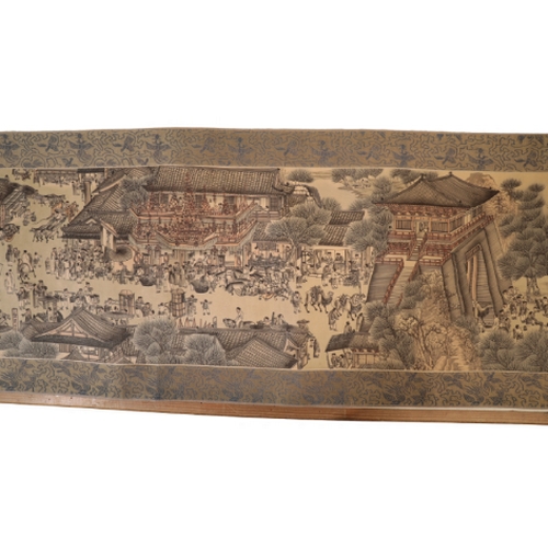 85 - CHINESE SCHOOL, a scroll depicting a continuous landscape with figures within a textile border, appr... 