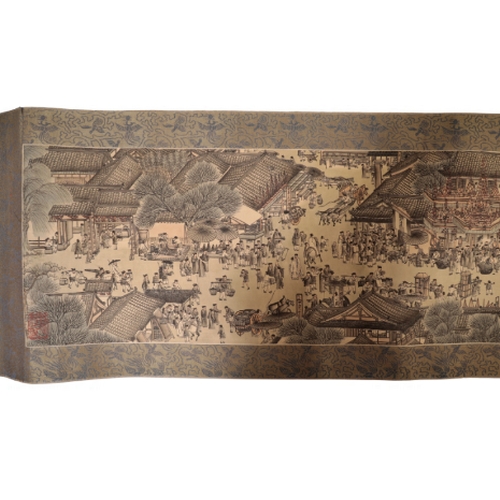 85 - CHINESE SCHOOL, a scroll depicting a continuous landscape with figures within a textile border, appr... 