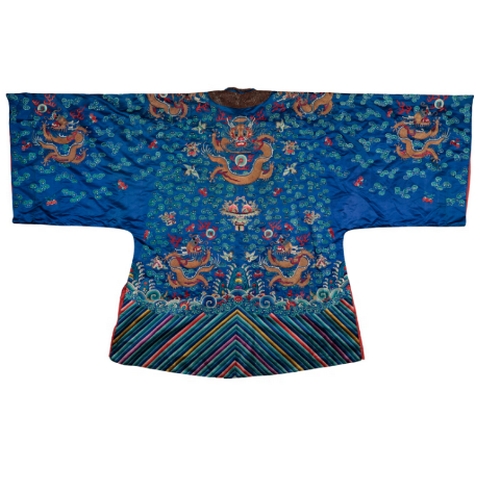 86 - A CHINESE BLUE SILK DRAGON ROBE embroidered in colourful silks with five- clawed dragons, birds and ... 