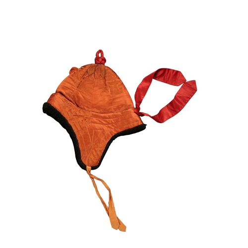 89 - A TIBETAN WARRIORS ORANGE ROBE buttoned at the side and with flared cuffs, 195cm wide across the sho... 