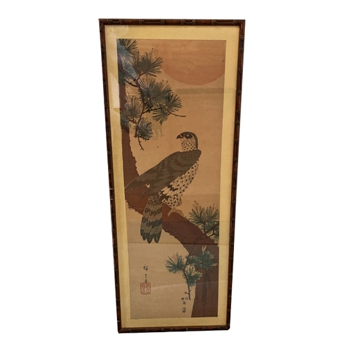 97 - JAPANESE SCHOOL A bird of prey perched on the trunk of a knarled pine tree, signed, coloured wood bl... 
