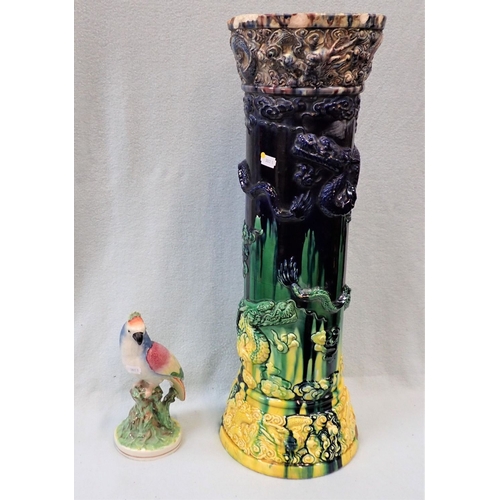 14 - A MAJOLICA JARDINIERE STAND IN CHINESE STYLE moulded with dragons (damaged) with a Staffordshire par... 