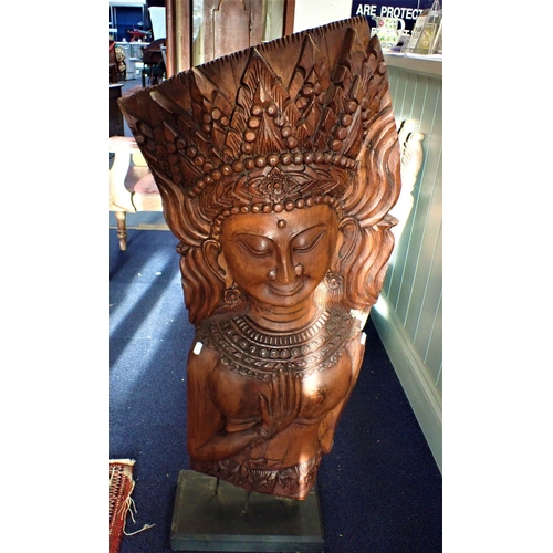 46 - A SUBSTANTIAL ASIAN TEAK CARVING OF A CROWNED FEMALE mounted on a stand 118cm high