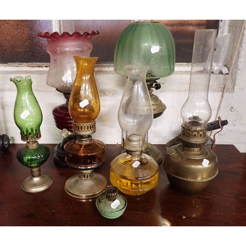 53 - A COLLECTION OF OIL LAMPS