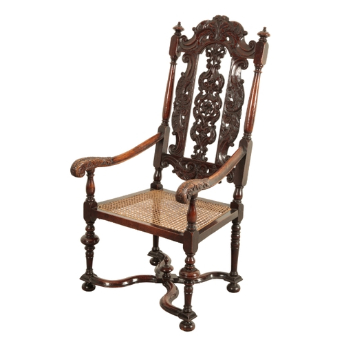 102 - A WILLIAM & MARY STYLE WALNUT ARMCHAIR 19th century, the heavily carved back over a square seat, on ... 