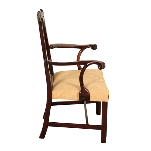 104 - A GEORGE III MAHOGANY CHIPPENDALE STYLE ARM CHAIR 19th century, the shaped cresting rail over a pier... 