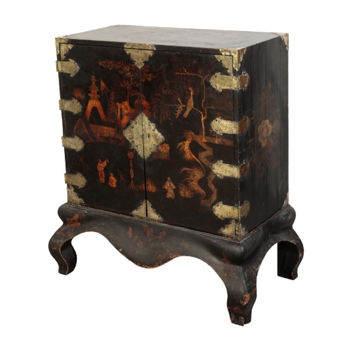 112 - A GEORGE I JAPANNED CABINET ON STAND early 18th century, the black lacquer decorated with figures an... 