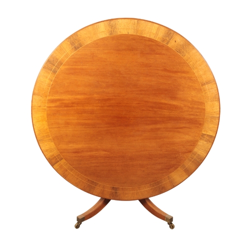 118 - A REGENCY STYLE MAHOGANY CENTRE TABLE 20th century, the cross-banded circular tilt-top, on a baluste... 