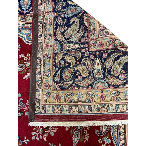 131 - A CENTRAL PERSIAN KERMAN CARPET 20th century, the central medallion on a contrasting ground populate... 