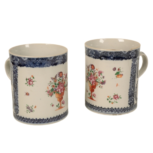 174 - A PAIR OF 19TH CENTURY CHINESE EXPORT MUGS the bodies each decorated with a vase of flowers, within ... 