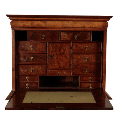 191 - A QUEEN ANNE WALNUT WRITING CABINET early 18th century, the top section with a moulded pediment abov... 