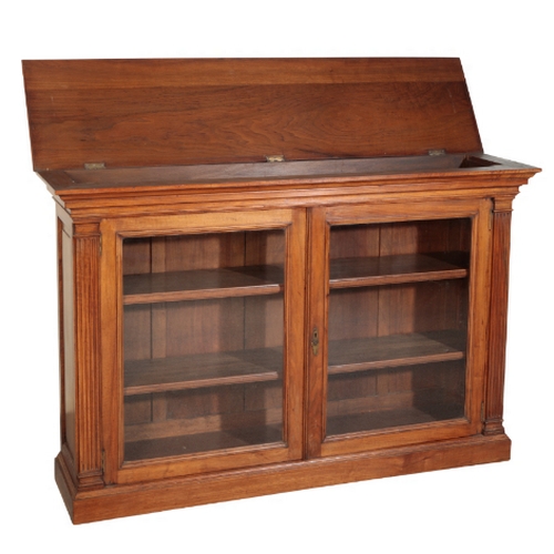 200 - A WALNUT BOOKCASE Circa 1860, with a hinged top revealing a compartment above two glazed doors revea... 