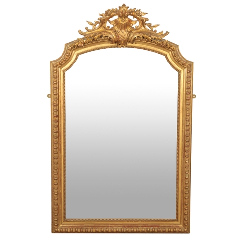 214 - A GILTWOOD OVERMANTEL MIRROR late 19th century, with a carved and scrolling cresting rail, above a c... 