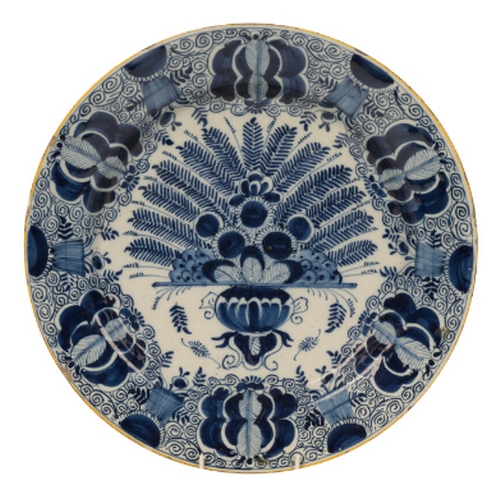 216 - A DUTCH DELFT CHARGER 18th century, the body with a central vase of flowers, marked for the De Claau... 