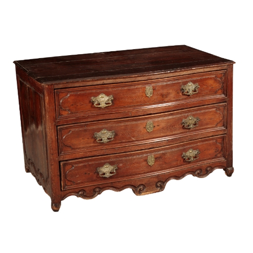 217 - A FRENCH WALNUT SERPENTINE COMMODE 19th century, with moulded long drawers, above a carved and shape... 