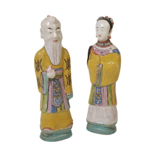 268 - A CHINESE PORCELAIN FIGURE OF SHULAO decorated in bright polychrome enamels and standing on a moulde... 