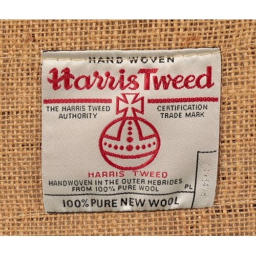 271 - A CONTEMPORARY SOFA covered in hand woven Harris Tweed, with label to the underside, on turned front... 