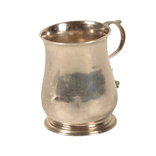 30 - A GEORGE II SILVER MUG by William Justis, London, 1757, of baluster form, bearing the Medlycott cres... 