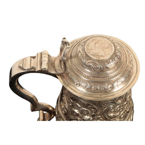 31 - A GEORGE II SILVER TANKARD by William Williams I, London, 1743, of baluster form, later decorated wi... 