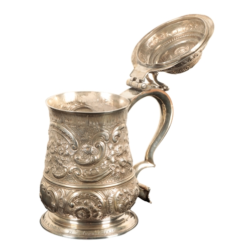 31 - A GEORGE II SILVER TANKARD by William Williams I, London, 1743, of baluster form, later decorated wi... 