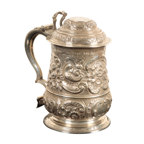 31 - A GEORGE II SILVER TANKARD by William Williams I, London, 1743, of baluster form, later decorated wi... 