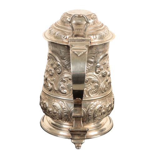 31 - A GEORGE II SILVER TANKARD by William Williams I, London, 1743, of baluster form, later decorated wi... 