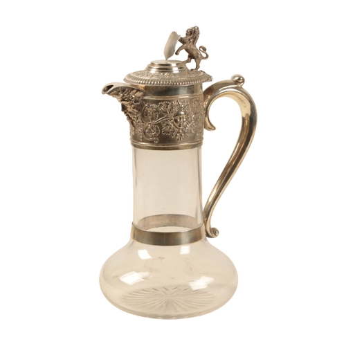 37 - A SILVER MOUNTED CLARET JUG by Horace Woodward & Co Ltd, London, 1911, with a heraldic lion and shie... 