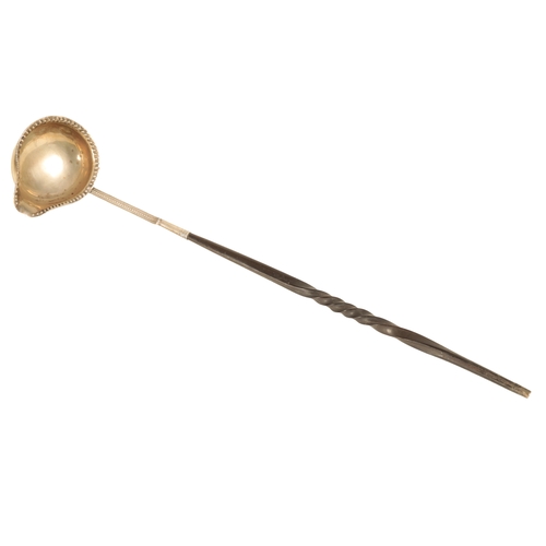 48 - A WHITE METAL TODDY LADLE ENGRAVED apparently unmarked, the beaded oval bowl with spout engarved ' J... 