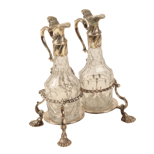 83 - A GEORGE II SILVER MOUNTED AND CUT GLASS CRUET SET by Samuel Wood, London, 1756, with gadrooned bord... 