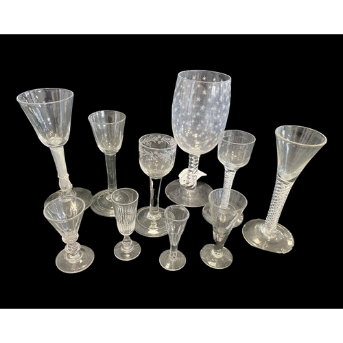 193 - AN 18TH CENTURY WINE GLASS with an air twist stem, 17cm high, together with a collection of further ... 